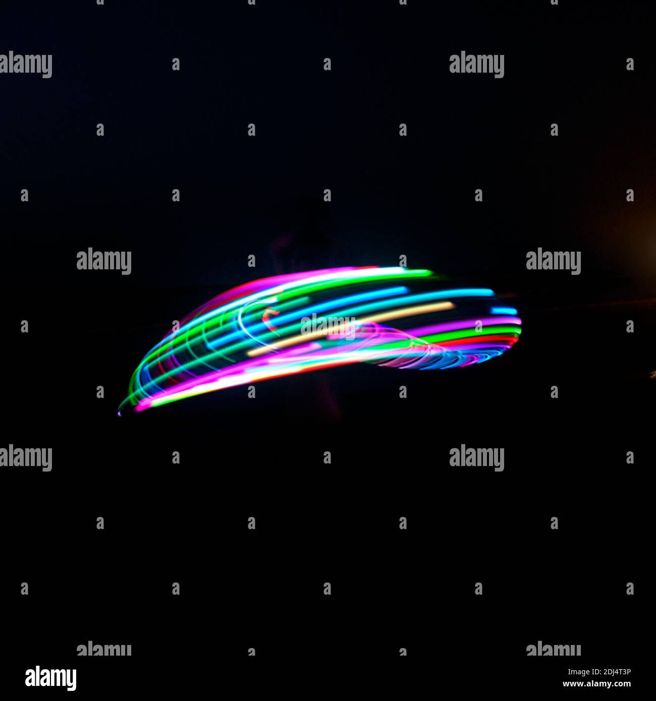 Hula Hoop psychédélique la nuit Banque D'Images