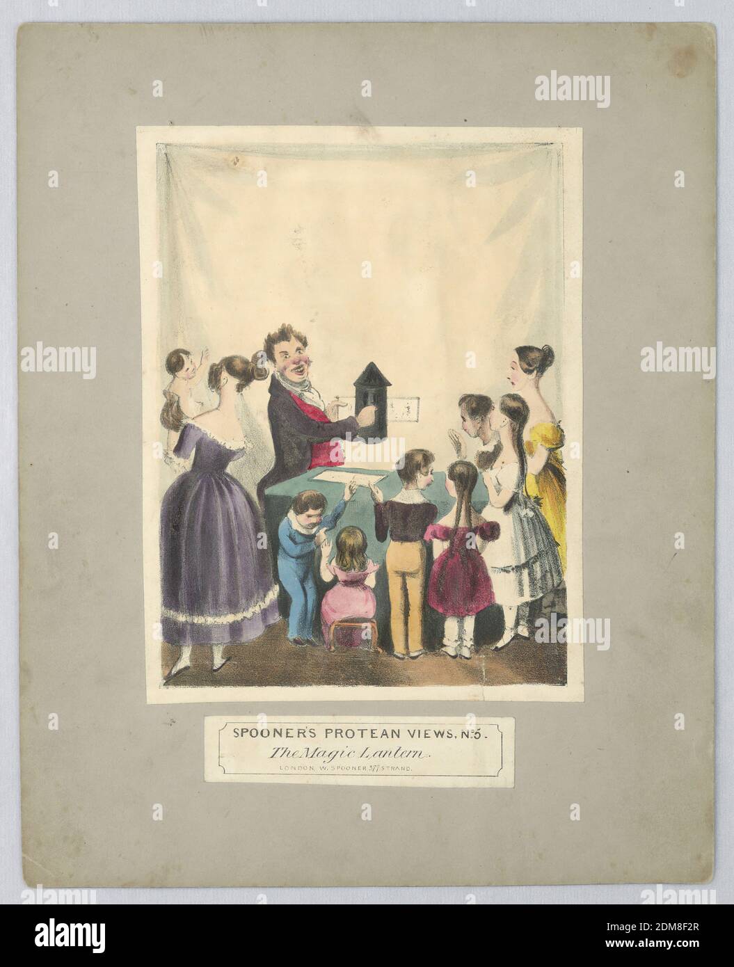 Jouet optique: 'The Magic Lantern' (vues protean de Spooner, non 5), William Spooner, Angleterre, active 1830 – 1854, lithographe, pinceau et aquarelle sur papier, monté, deux adultes et un groupe d'enfants sont témoins d'un spectacle de lanterne magique - quand on les tient à la lumière, on voit une caricature d'une figure noire dansant sur la mélodie d'un diable jouant du violon. Ci-dessous, titre et nom de l'éditeur., Londres, Angleterre, ca. 1838, Imprimer Banque D'Images