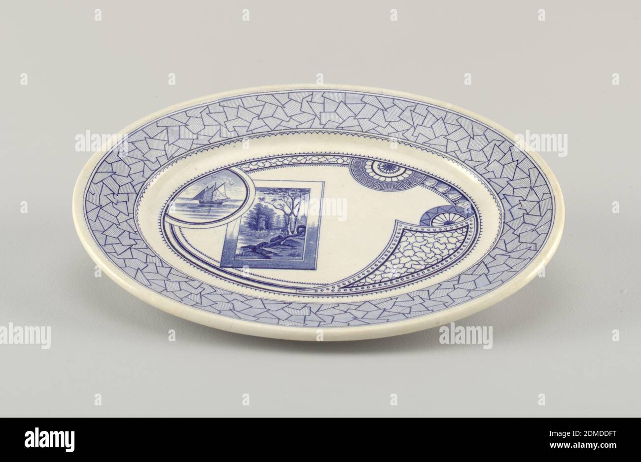 Excelsior, Old Hall Earthenware Co., Ltd., English, Glazed earthenware with transfer-printed decoration, Oval form, the white crackled ground decorated with blue Japanese-inspired tranfer-printed decoration: the rim with a wide band of abstract geometric design, with fine hatched lines, surrounding a narrow scalloped band; the well decorated with bands, medallions and panels of geometric motifs, a medallion showing a sailing vessel on water superimposed on a landscape within a rectangular frame., ca. 1880, ceramics, Decorative Arts, Platter, Platter Banque D'Images