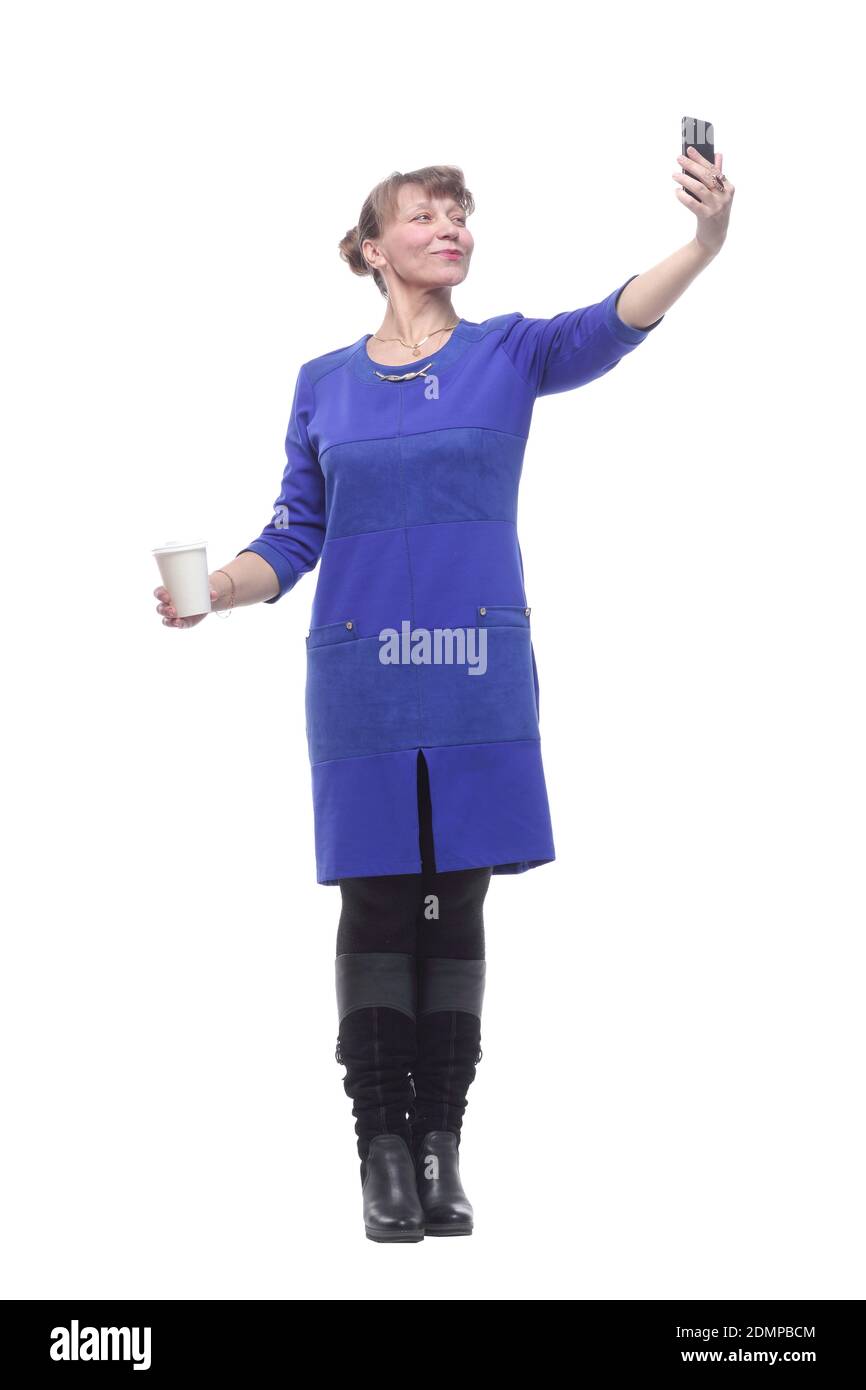 Beautiful blonde caucasian woman with takeaway coffee taking a selfie Banque D'Images