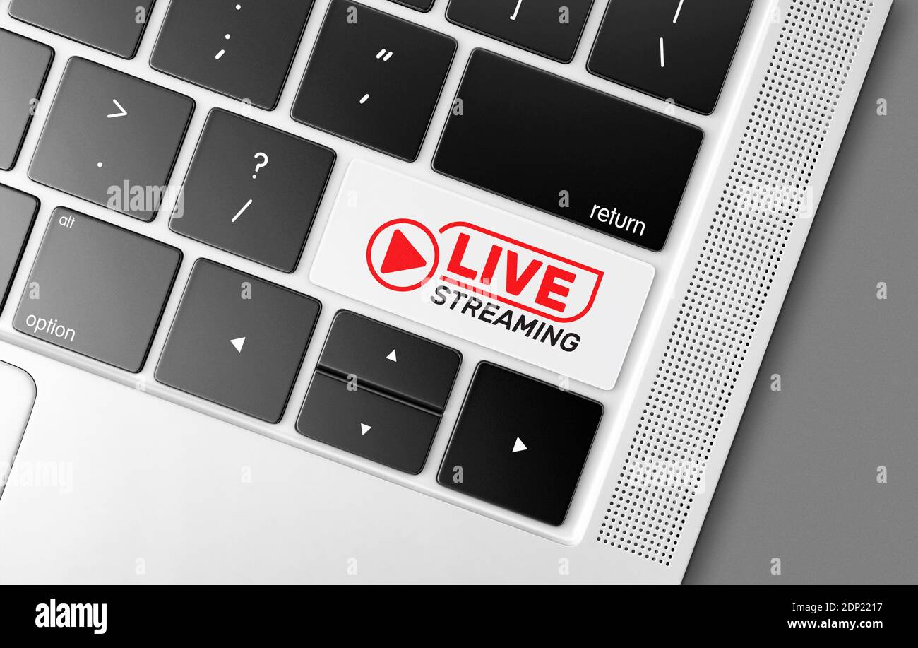 Touche de diffusion Internet en direct dédiée sur un clavier d'ordinateur noir, image conceptuelle des communications mondiales et des technologies modernes Banque D'Images