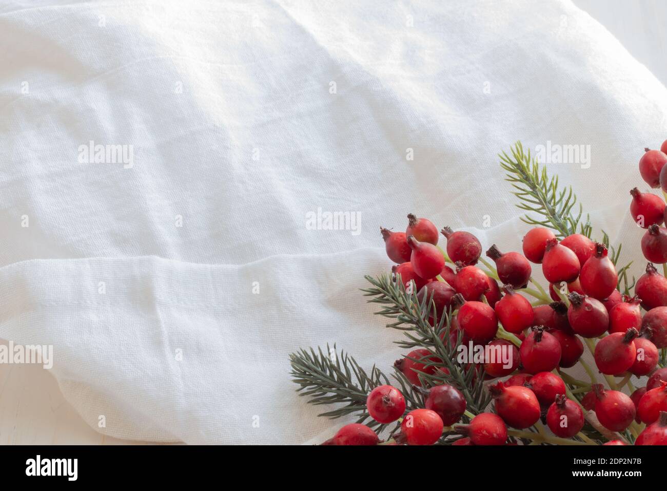 Fond de baies de Noël sur linge blanc Banque D'Images