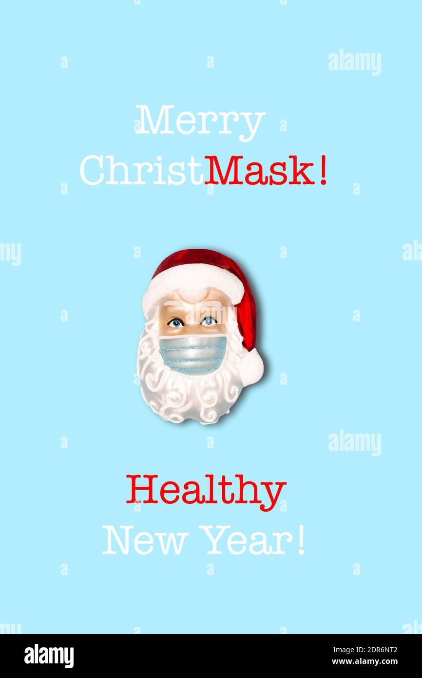 Joyeux masque de Noël bonne santé Nouvelle année. Décoration de Noël Père Noël portant un masque de protection Banque D'Images
