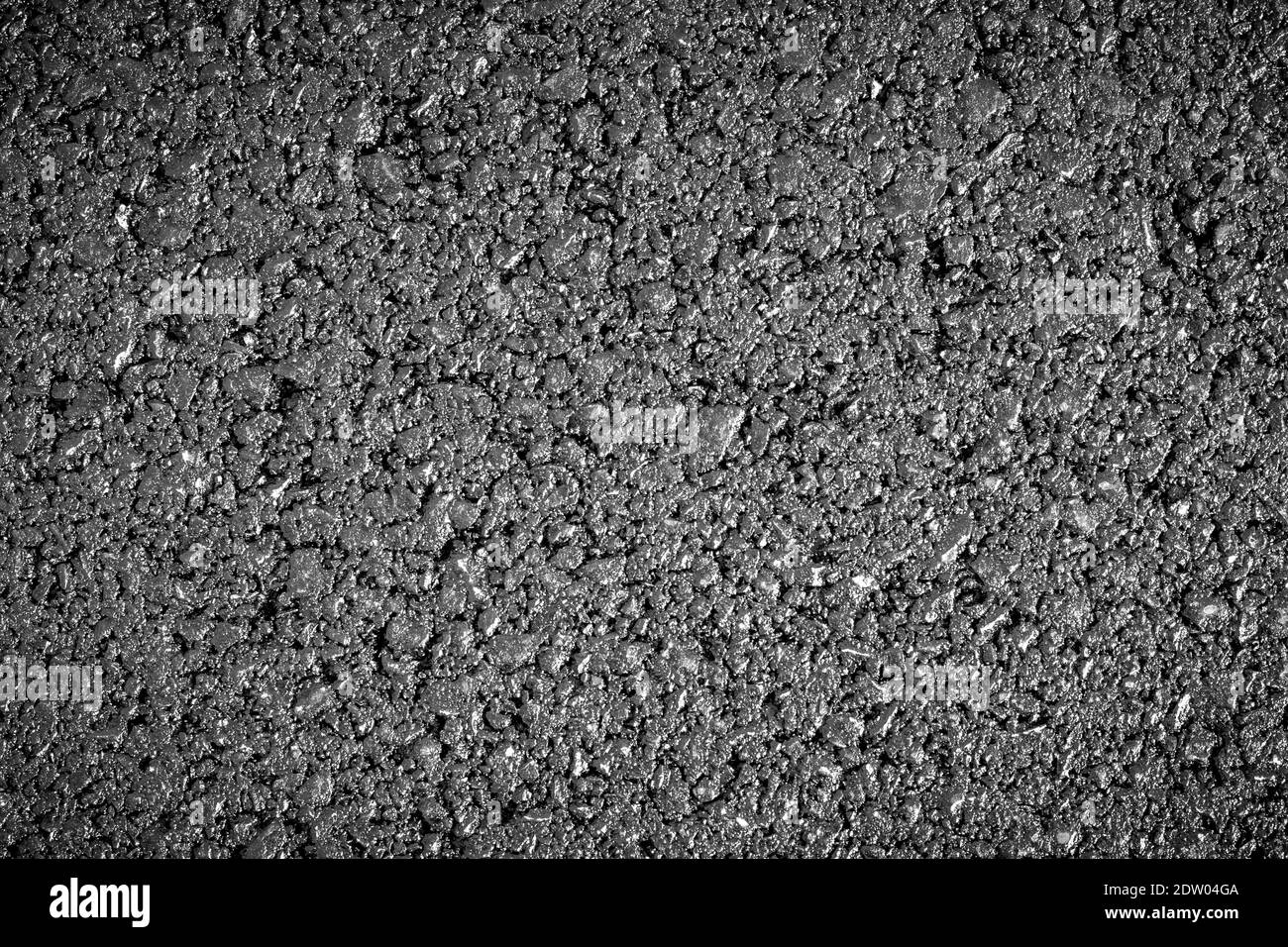 Nouvelle texture d'asphalte grise. Image lumineuse et panoramique de l'arrière-plan de la route. Détail goudron. Ressource graphique Banque D'Images