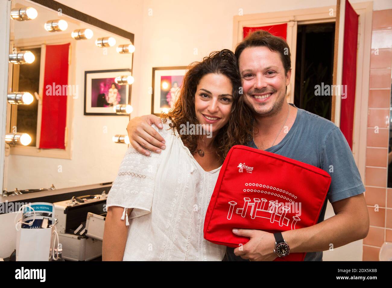 Davy Sardou avec sa femme Noemie Elbaz participant à l'opération le 5 août 2014 au 30e Festival Ramatuelle à Ramatuelle, dans le sud de la France. Photo de Cyril Bruneau/ABACAPRESS.COM Banque D'Images