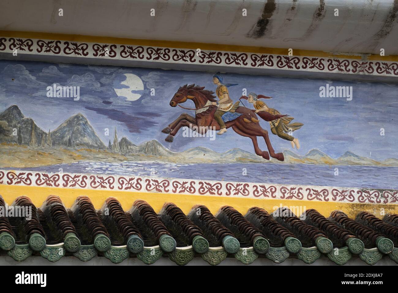 Une fresque de figures historiques sur un mur de temple Banque D'Images