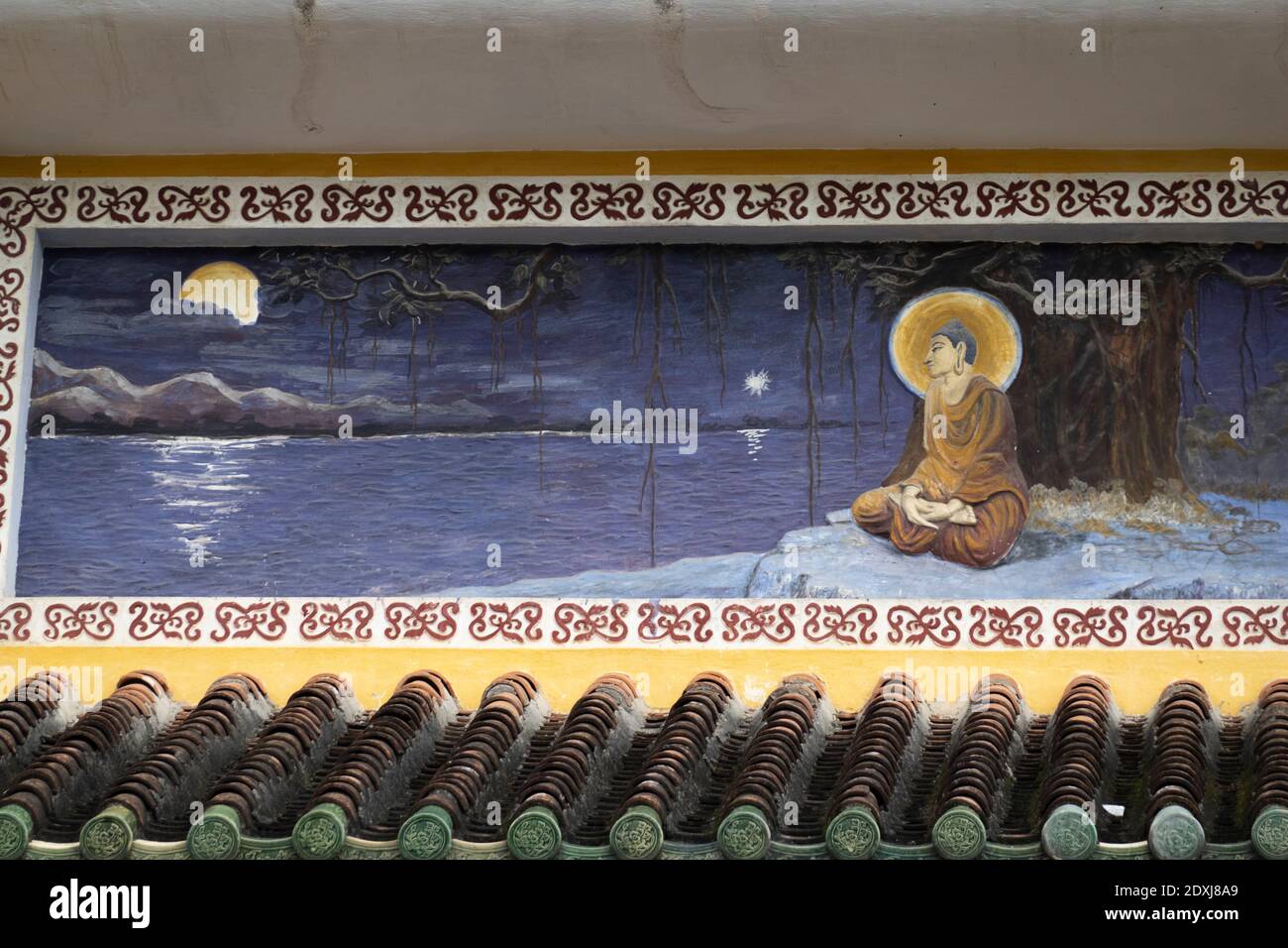 Une murale de Bouddha sur un mur de temple Banque D'Images