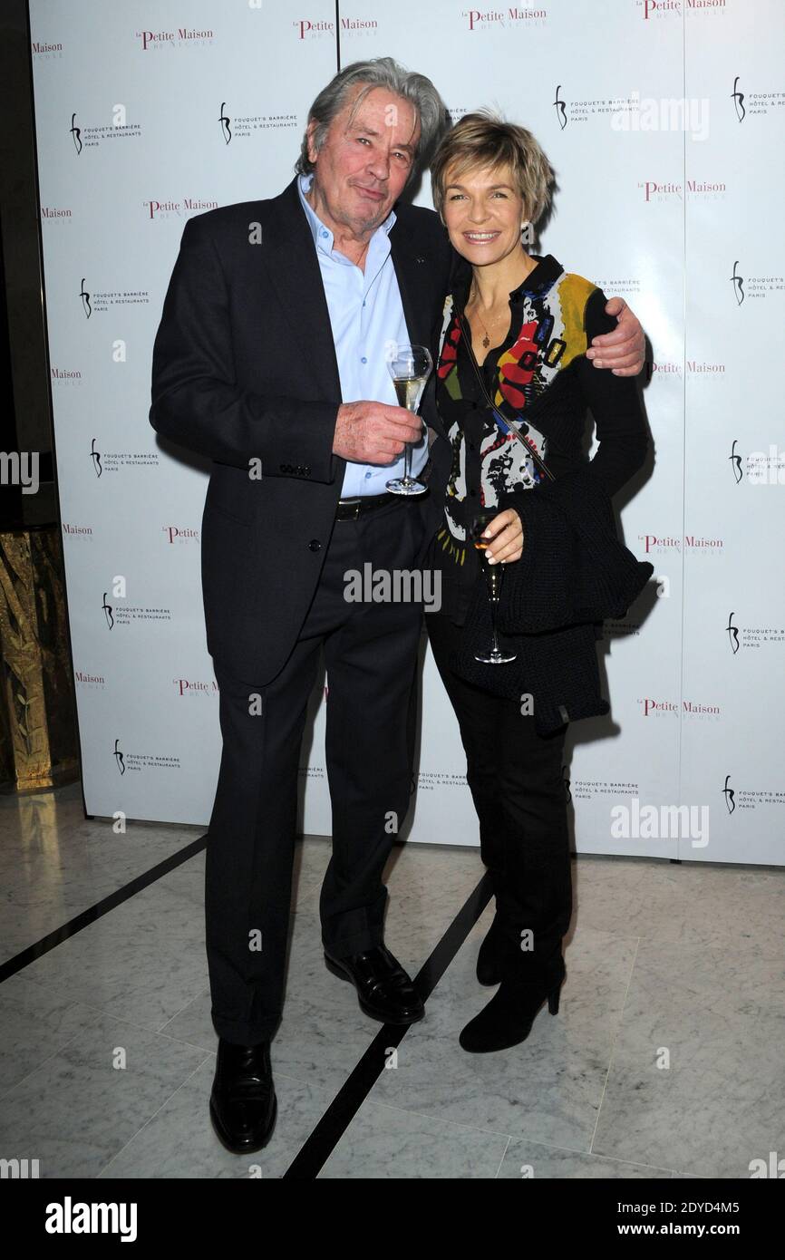 Alain Delon et Véronique Jannot assistent à la fête d'ouverture du nouveau  restaurant « la petite Maison de Nicole » à l'hôtel Fouquet's Barriere à  Paris, France, le 22 janvier 2013. Photo
