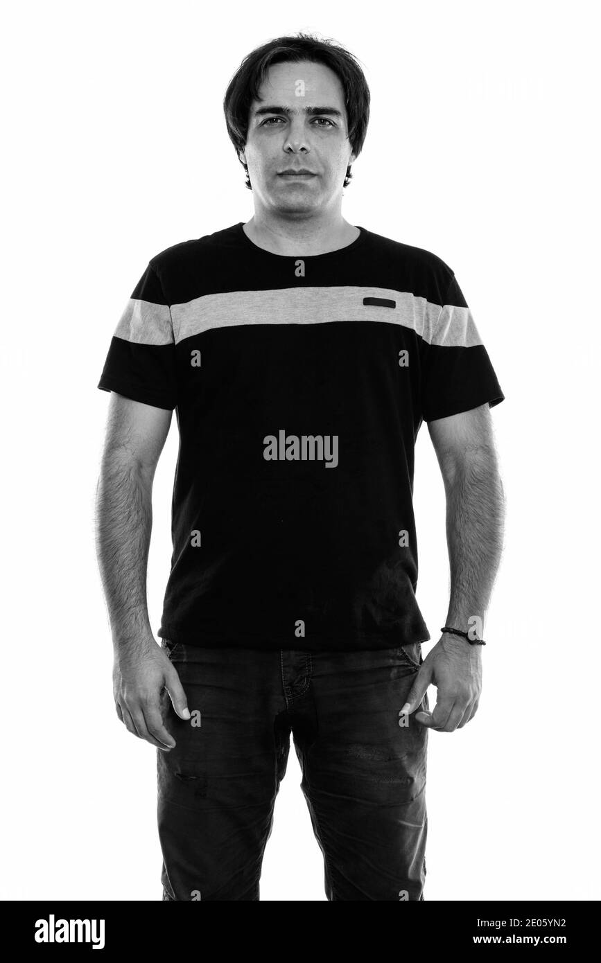 Studio shot of young man standing persan Banque D'Images Studio shot of young man standing persan Banque D'Images