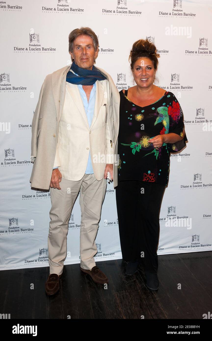 Dominique Desaigne (Président du Groupe Lucien Barriere) et Marianne James  participant à la première française du film 'le fils de l'autre' qui s'est  tenu au Cinéma Publicis le 19 mars 2012 à