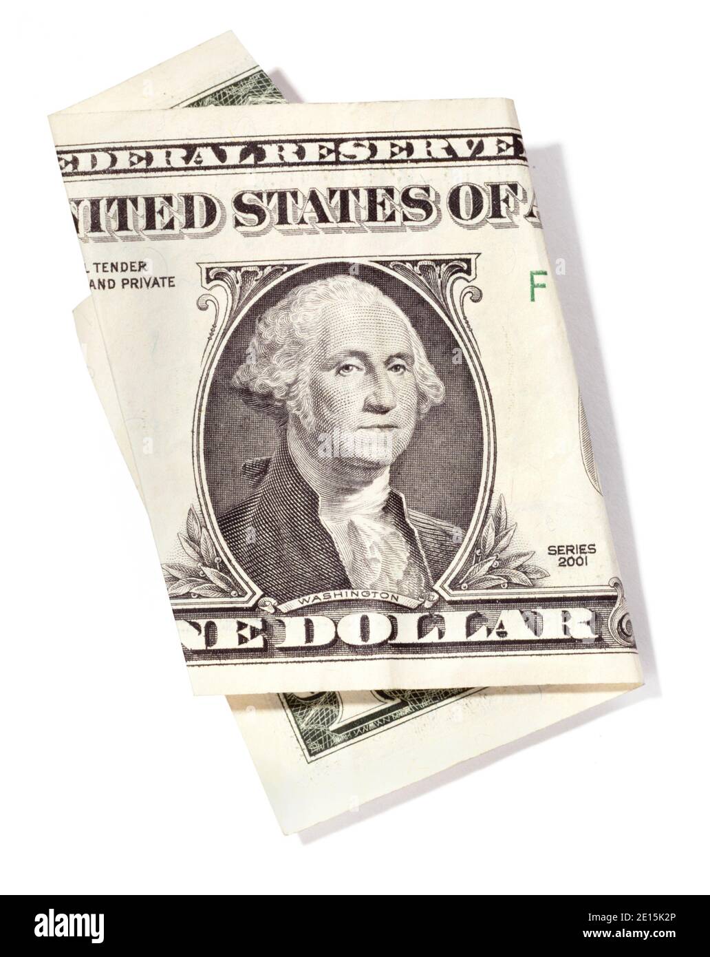 Une facture de dollar américain pliée est photographiée sur fond blanc Banque D'Images