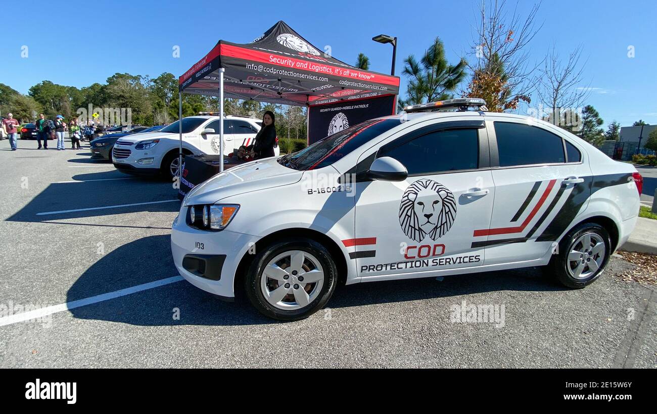 Orlando, FL USA - 1 mars 2020: Une automobile de COD protection Services fournissant la sécurité à un libre pour le public Cars and Coffee car show. Banque D'Images