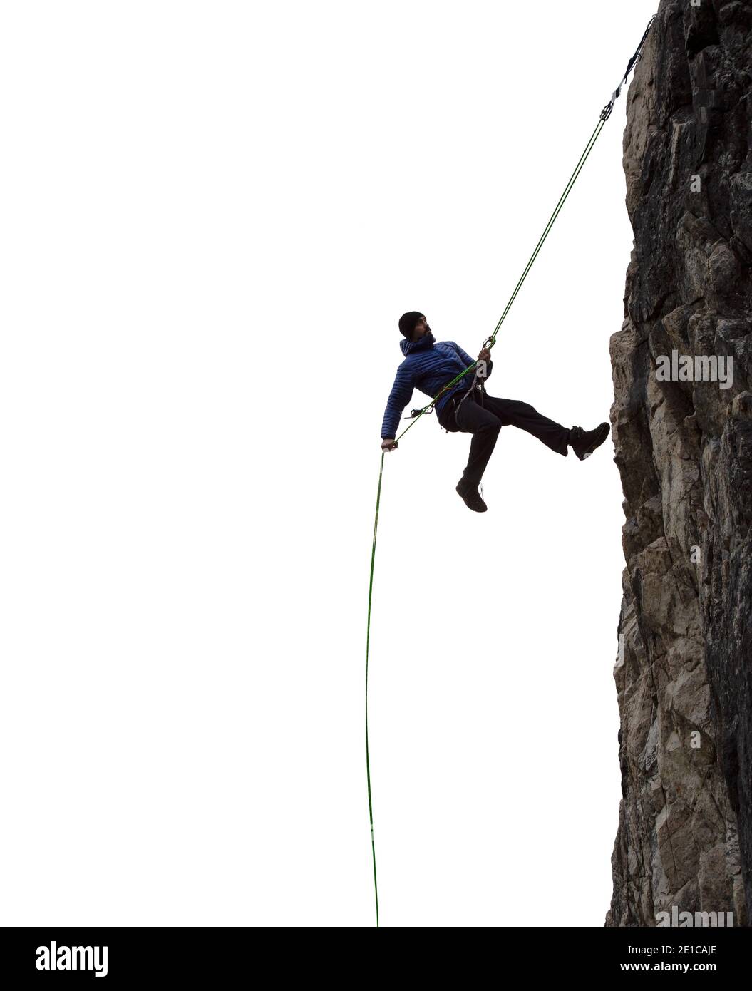 Aventure épique Extreme Sport composite de Rock Climing Homme Rappelling a Cliff. Banque D'Images