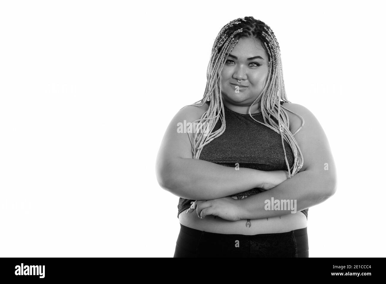 Studio shot of young Asian fat woman with arms crossed Banque D'Images