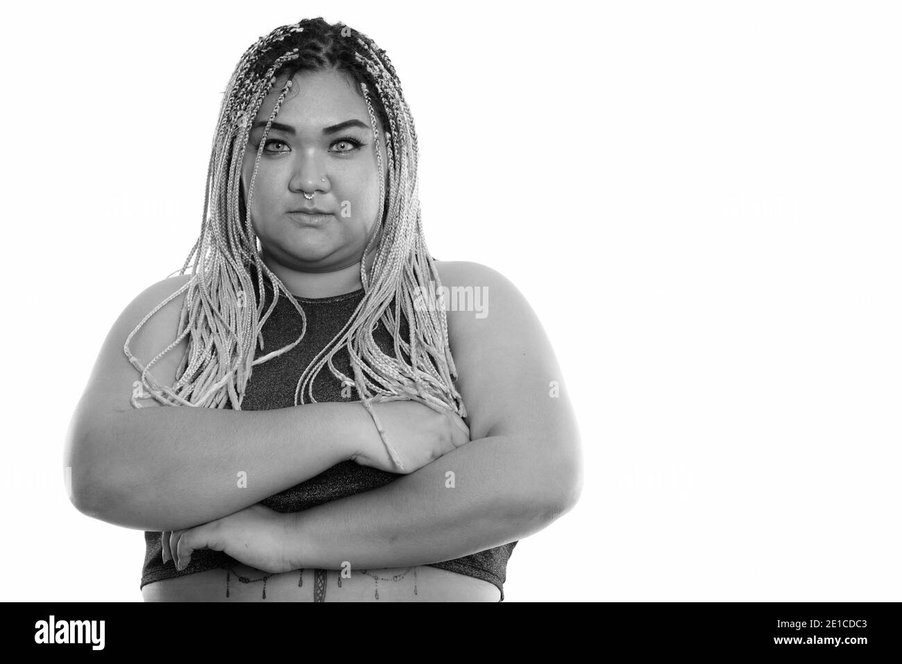 Studio shot of young Asian fat woman with arms crossed Banque D'Images