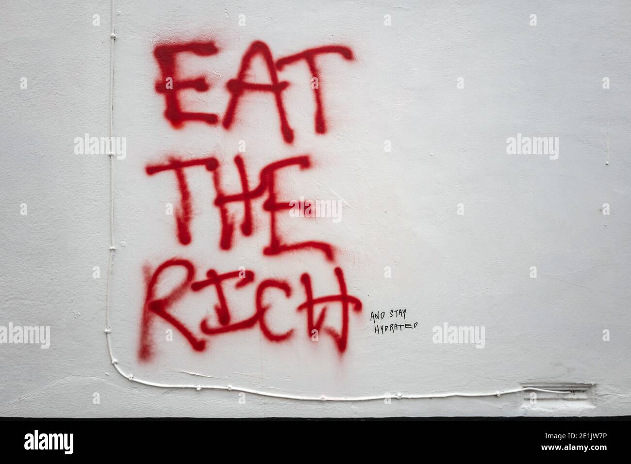 Brighton, 5 janvier 2021: Street-art / graffiti à Brighton, Eat the Rich Banque D'Images