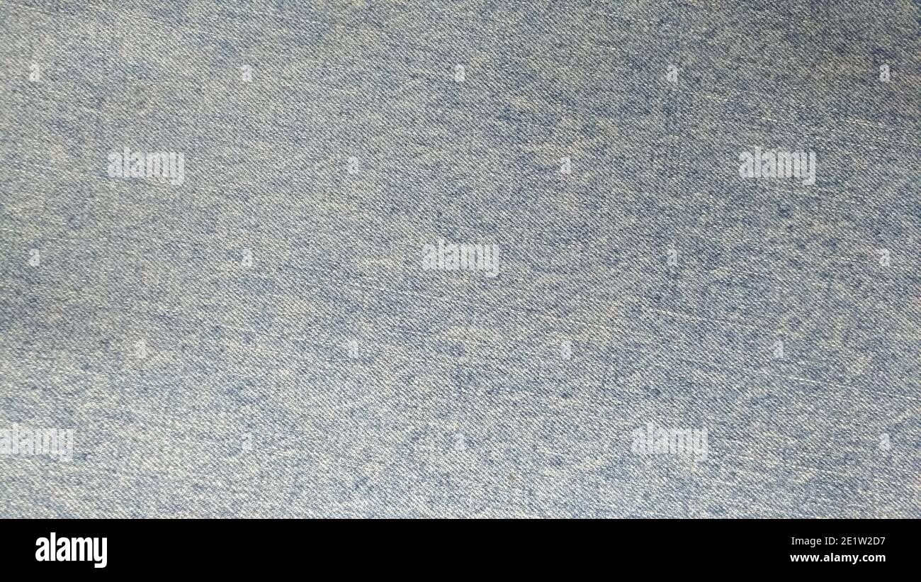 La texture du denim, bleu-gris décoloré et versé Banque D'Images