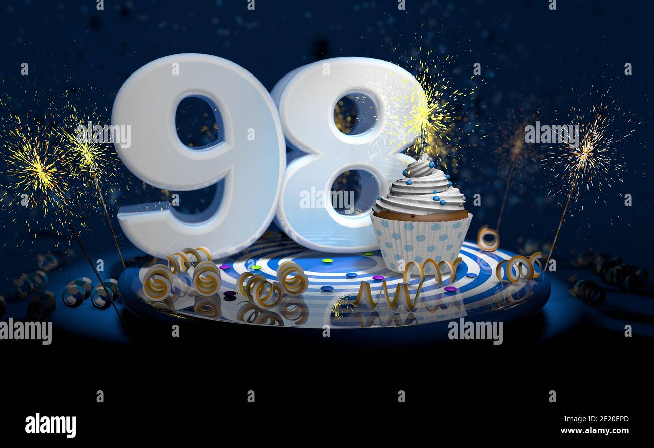 Cupcake avec bougie étincelante pour le 98e anniversaire ou anniversaire avec grand nombre en blanc avec des banderoles jaunes sur une table bleue avec fond sombre plein Banque D'Images