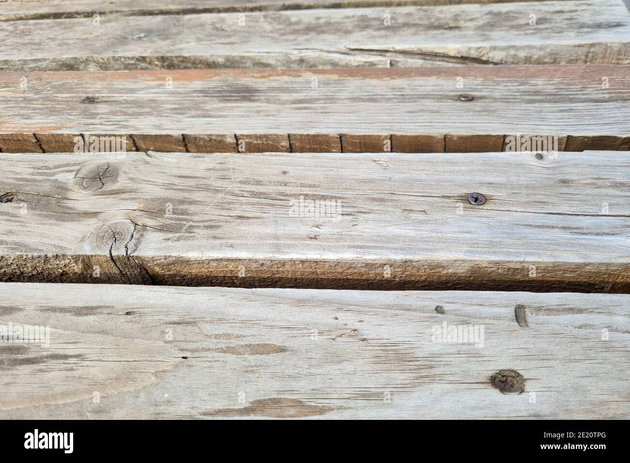 Texture d'un arrière-plan abstrait de banc gris en bois. Banque D'Images