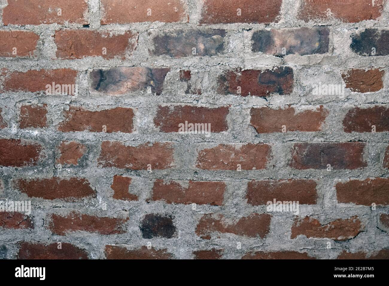 Photo d'un mur de briques en pierre à la lumière du soleil - construction Banque D'Images