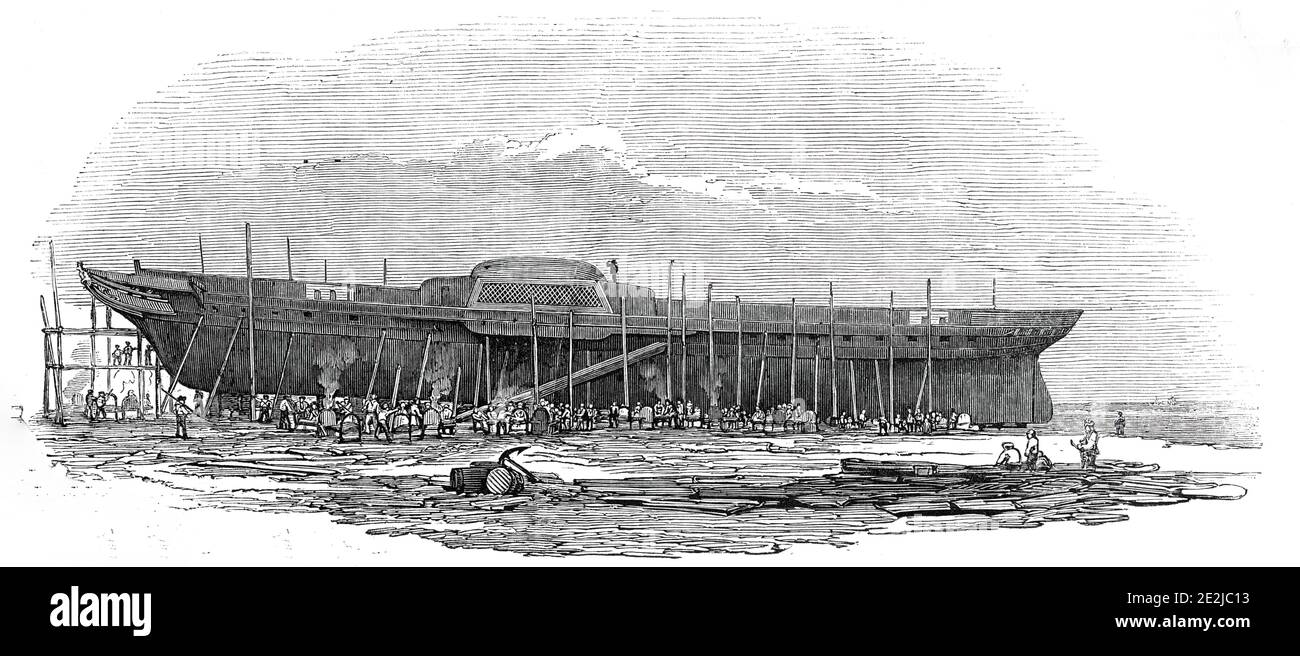 Fer vapeur-frégate de H.M. « Trident », 1845. « le Trident est le premier navire de guerre à vapeur de fer commandé par l'amirauté de sa Majesté à être construit. Elle a été lancée à partir de Messrs Ditchburn et Mare, vaste chantier de construction, à Blackwall [sur la Tamise à Londres]... la peau de fer est de 3/4 pouces d'épaisseur à la quille, diminuant vers le haut à la gunwale à 1/2 pouces. La peau contient 1400 plaques de fer, qui sont rivées l'une à l'autre, et aux côtes et à la quille, par 200,000 rivets. Chaque rivet a été forgé rouge chaud, et a exigé les ouvriers unis de trois ouvriers et deux garçons pour le riveter dans son corre Banque D'Images