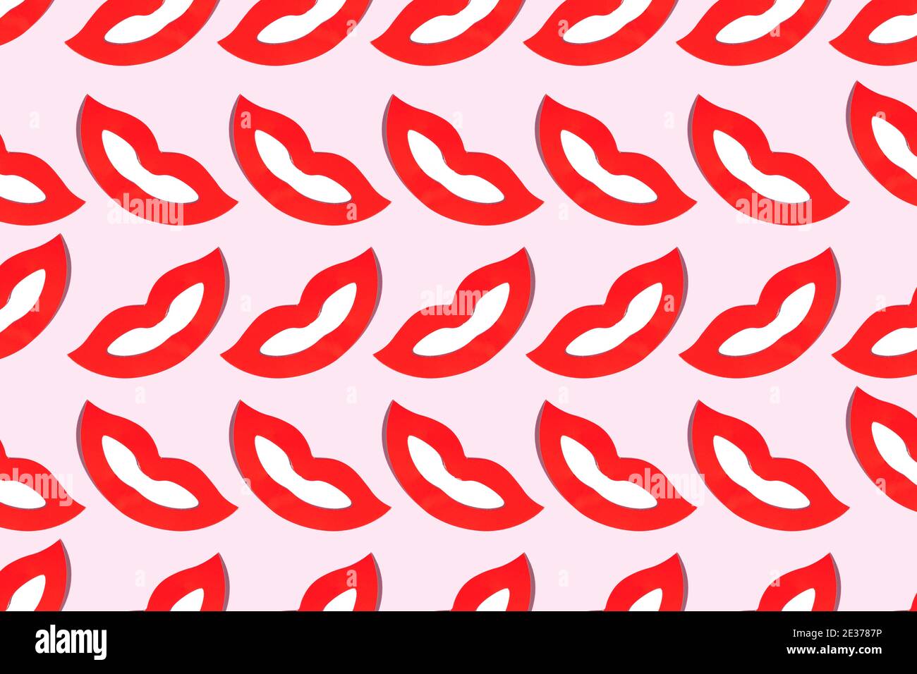 Motif de sourires sans couture avec lèvres rouges pour la Saint-Valentin ou les fous rient sur fond rose Banque D'Images