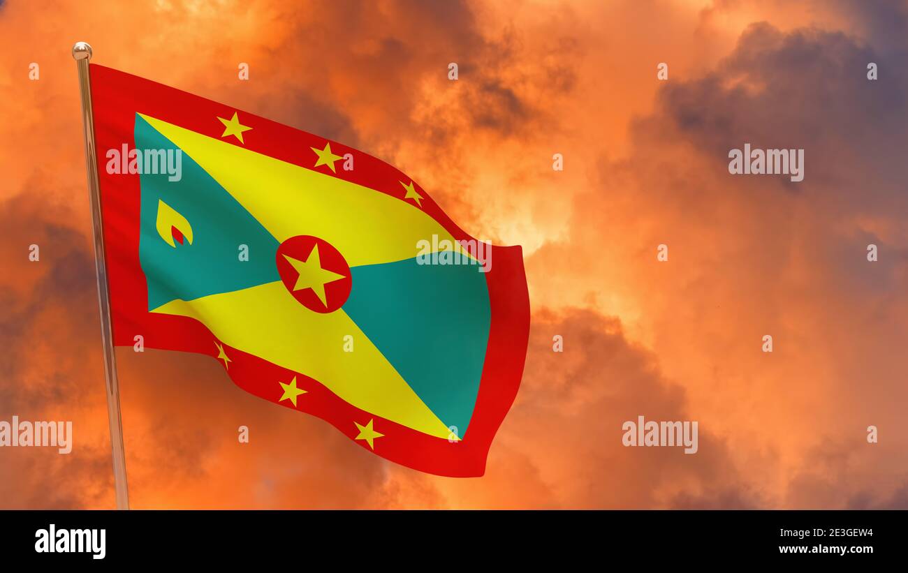 Drapeau de la Grenade sur la perche. Arrièreplan spectaculaire. Drapeau national de la Grenade