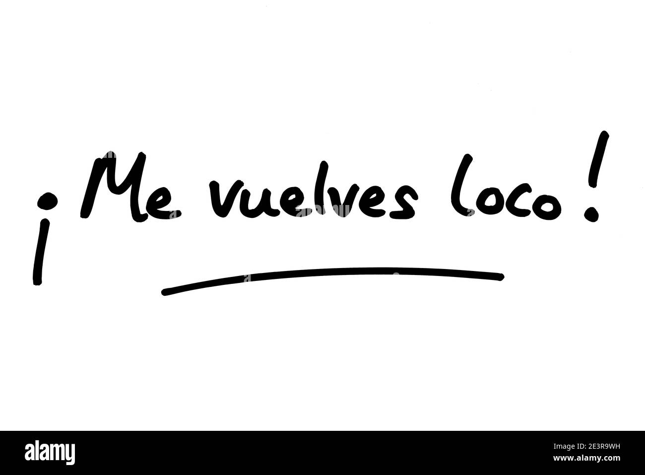 Me vuelves loco! - signifie IM Crazy sur vous, en espagnol, manuscrit sur fond blanc. Banque D'Images