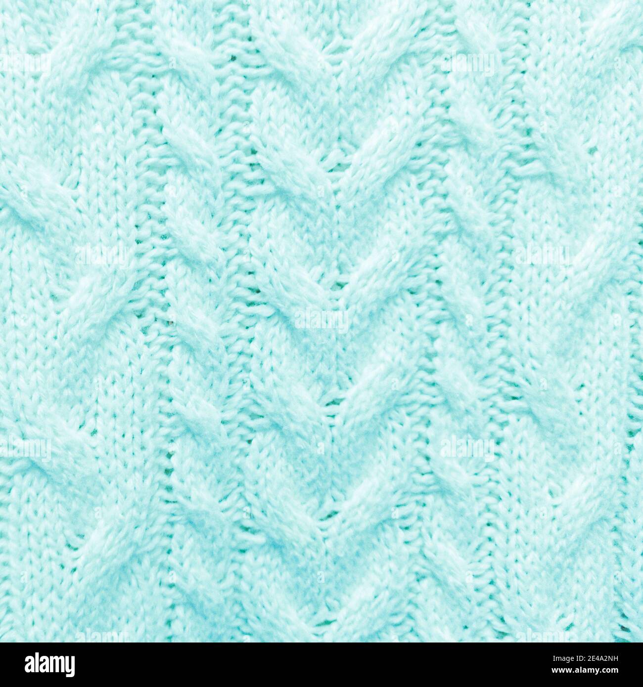 Arrière-plan tricoté turquoise à motif texturé. Banque D'Images