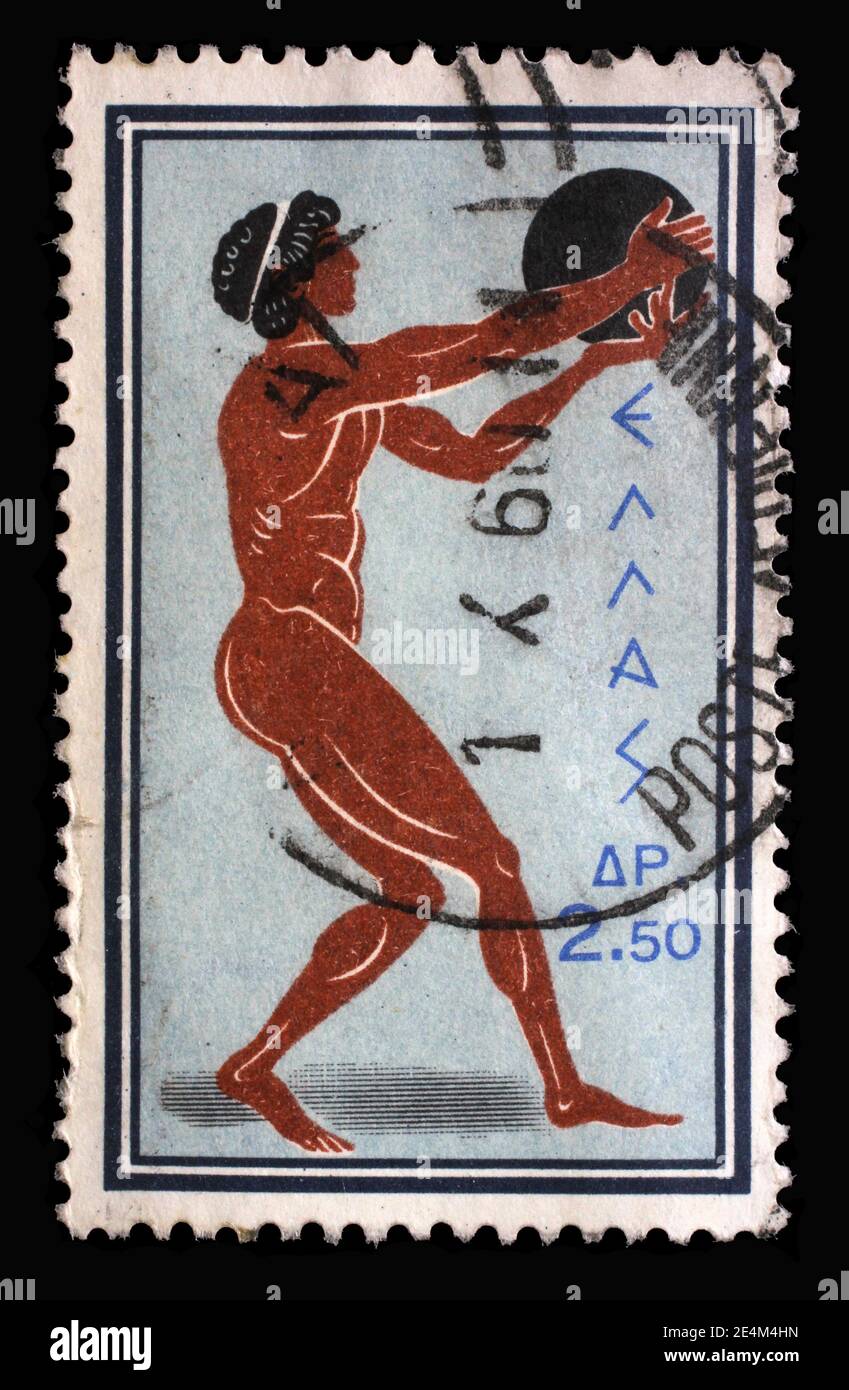 Timbre imprimé en Grèce à partir du numéro des Jeux Olympiques de Rome montre Discus Throw, vers 1960. Banque D'Images