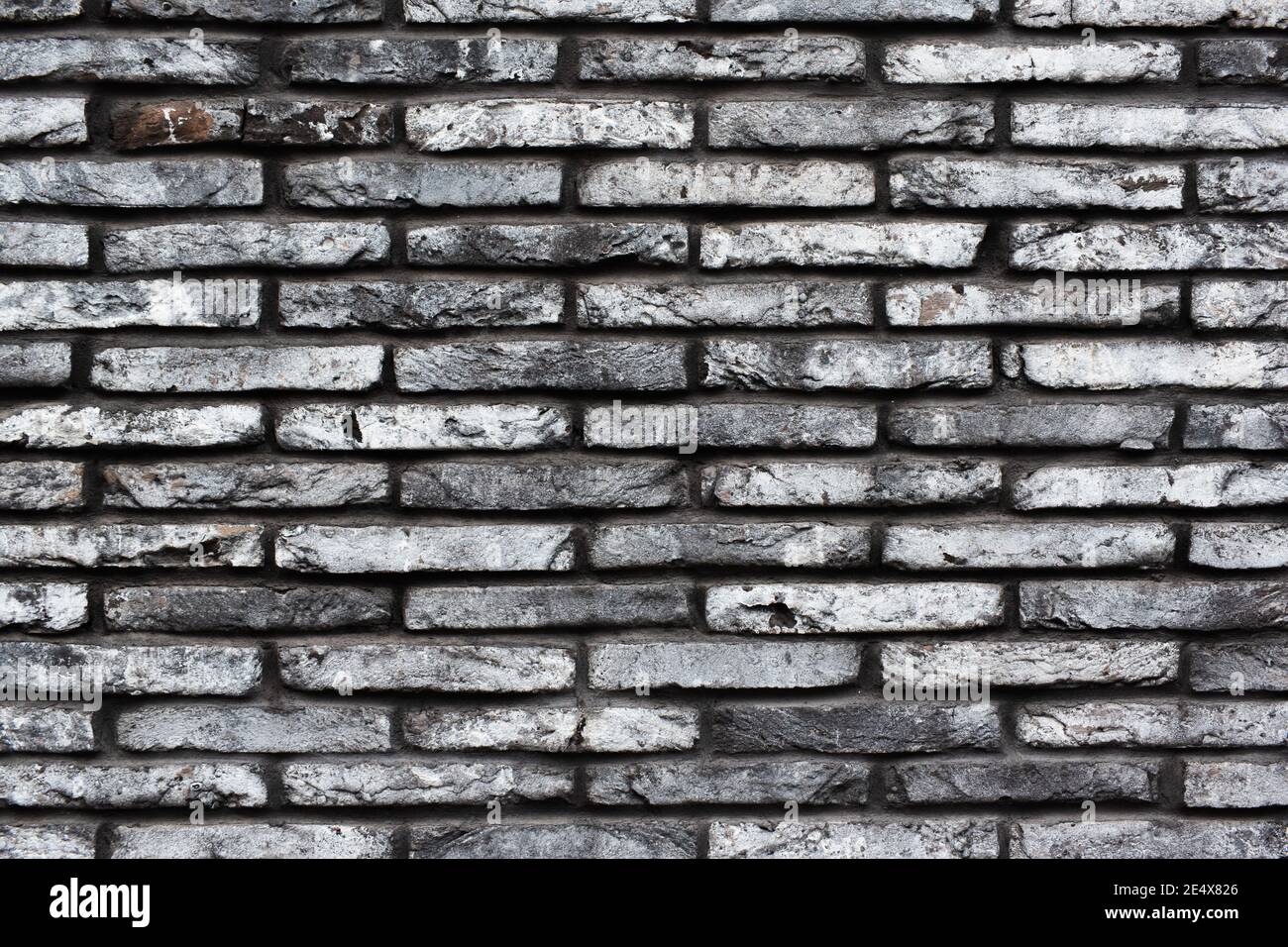 Fond de mur en briques gris. Texture pierre sombre pour le design Banque D'Images
