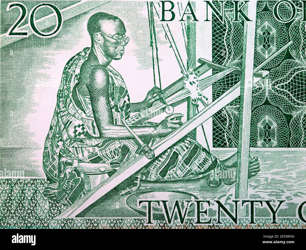 Kente weaver de l'ancien argent ghanéen Banque D'Images