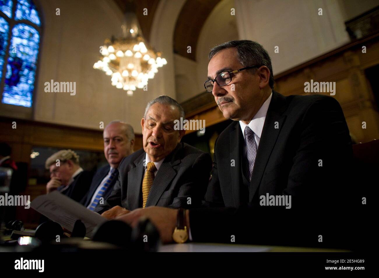 Costa Rica's Foreign Minister Rene Castro Salazar (R), members of the Costa  Rica legal team, Edgar Ugalde Alavarez (C) and Jorge Ubrina await the start  of hearings at the International Court of