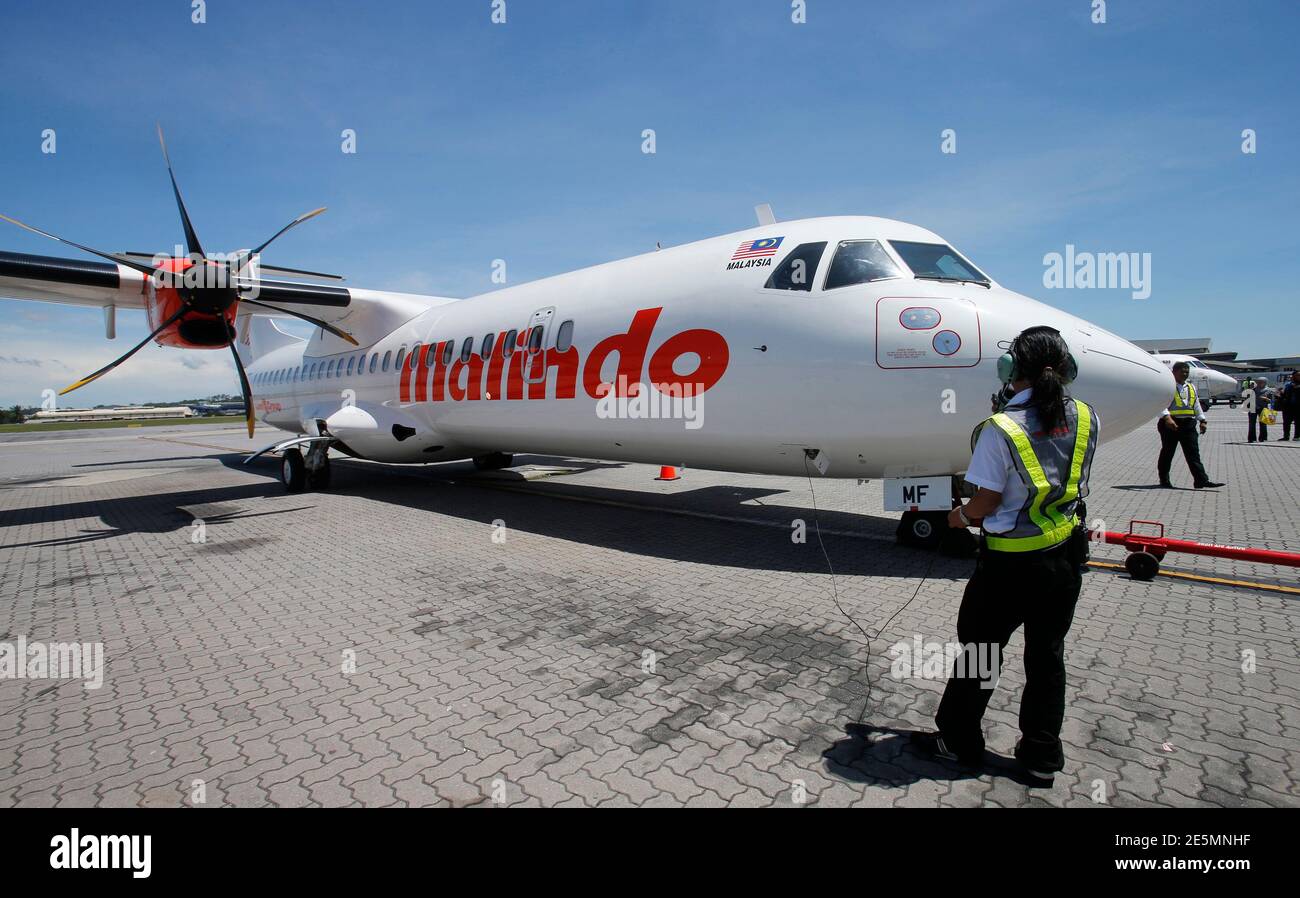 A Crew Of Malindo Air Prepares A Flight Departure At An Airport In Subang Outside Kuala Lumpur June 3 2013 Malaysia S Airasia Bhd Which Has Dominated Budget Air Travel In Asia With