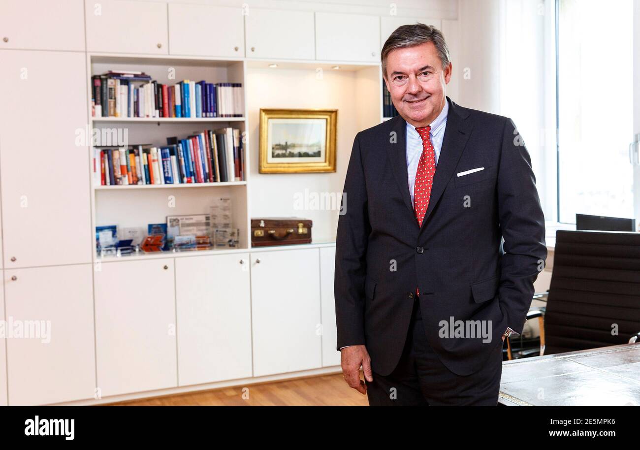 Michael Behrendt, chief executive of German tour operator Hapag-Lloyd,  poses in his office after a Reuters exclusive interview in Hamburg December  6, 2013. German shipping company Hapag-Lloyd's merger talks with Chile's  Vapores