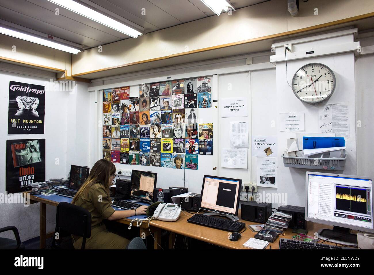 An Israeli soldier from Galei Tzahal, the Israeli army radio station, sits  in front of a computer as she edits music at the station's studios in  Jaffa, south of central Tel Aviv