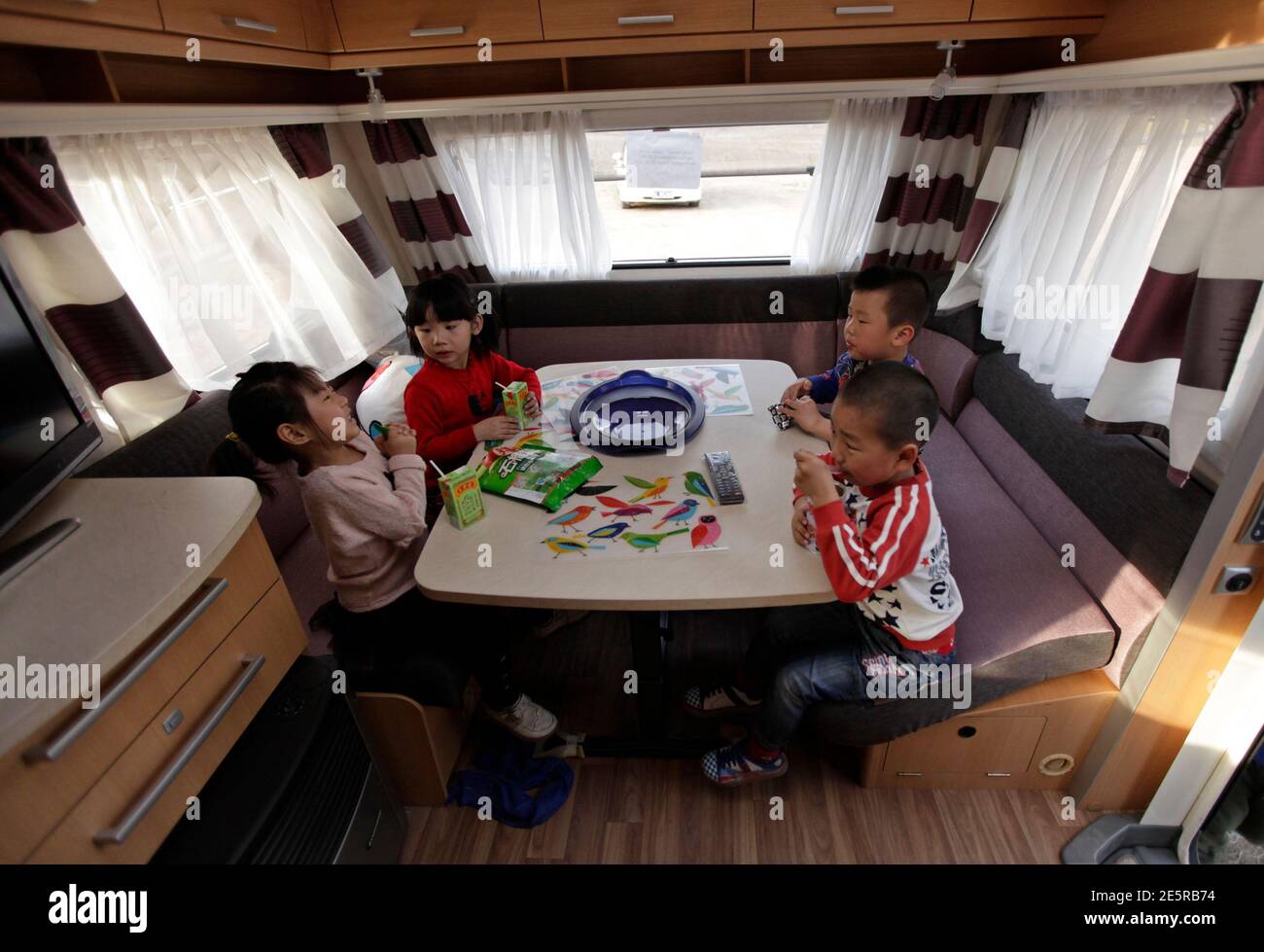 Children Sit Around A Table As They Play Inside A Recreational Vehicle Rv During A Camping Trip At A Rv Park On The Outskirts Of Beijing April 14 12 Chinese Buyers Bought