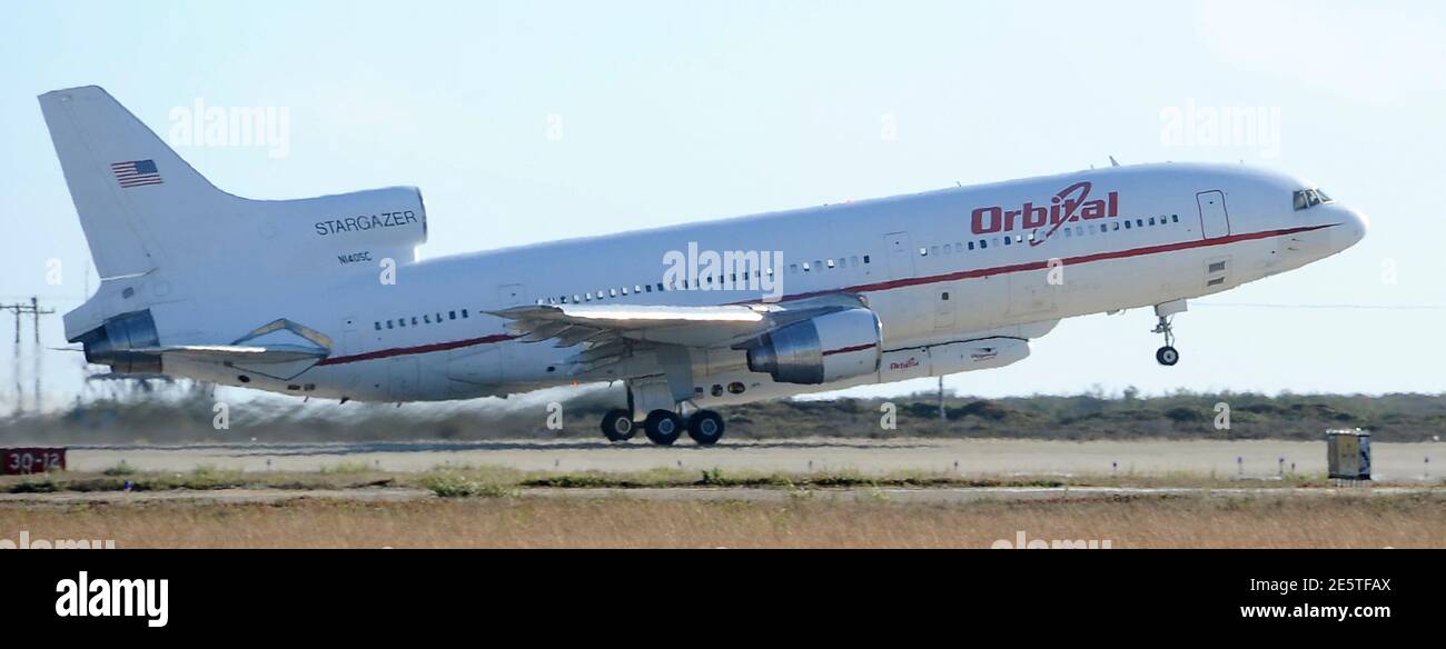 A Lockheed L-1011 TriStar jet takes off with the Orbital Pegasus rocket  (underneath it) at Vandenberg Air Force Base, California, June 27, 2013. A  small NASA telescope was launched into orbit on