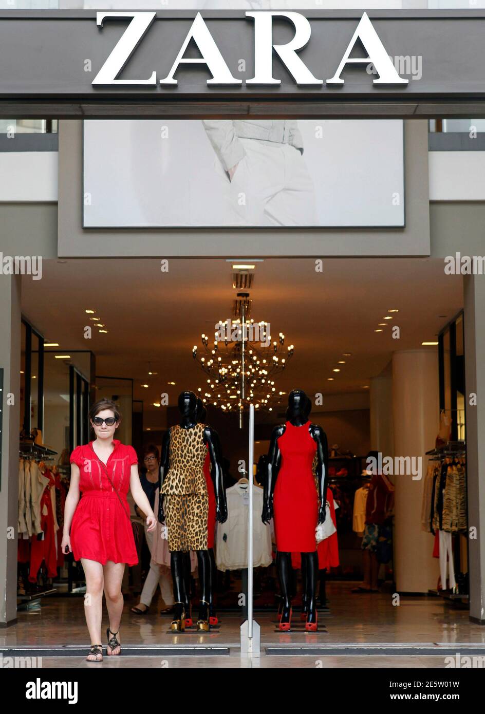 A woman leaves a Zara store in Barcelona June 13, 2012. Spain's Inditex SA,  the world's largest clothes retailer, bucked Europe's financial crisis with  a sharp rise in quarterly earnings by pleasing