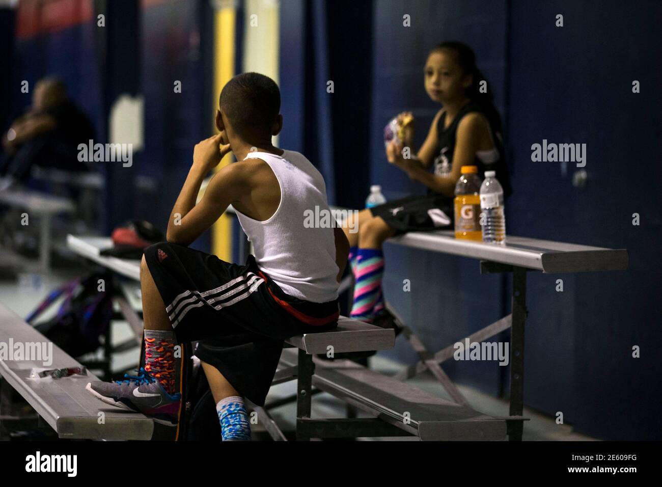 Downey Christian high school varsity basketball player 11-year-old Julian  Newman talks to a spectator (R) as he rests between Friday evening pickup  basketball games at Downey Christian School in Orlando, Florida February