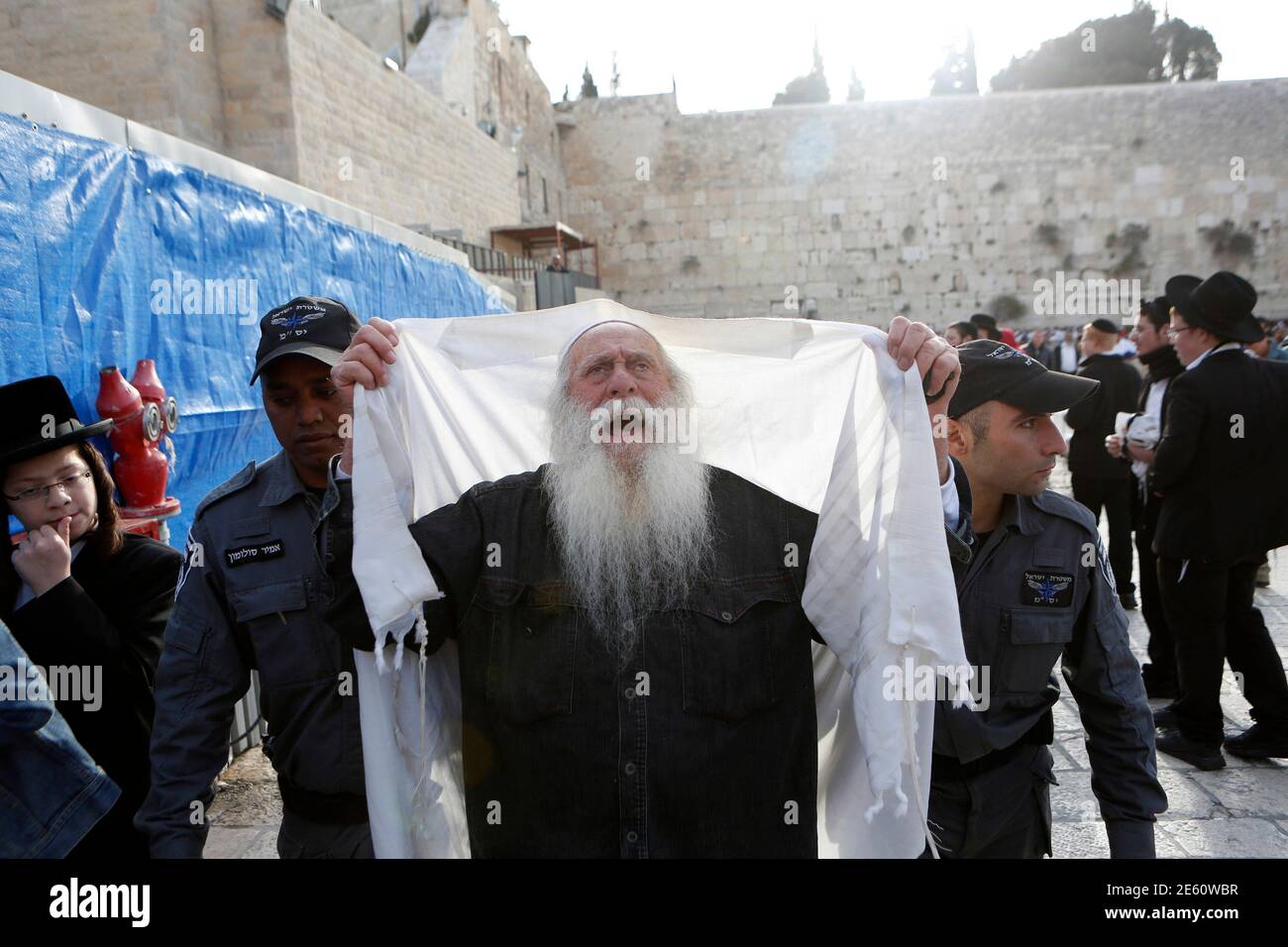 Israeli police officers detain an ultra 