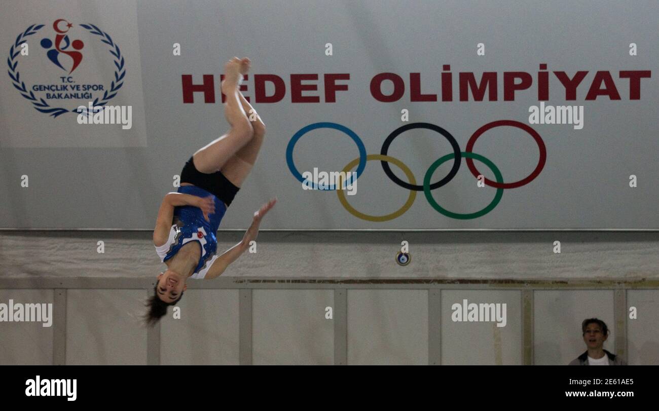 Turkish Olympic gymnast Goksu Uctas, with a banner reads that: "Target  Olympics" trains for the London 2012 Olympics at Murat Canbas sports hall  in Bolu, western Turkey, May 29, 2012. So excited