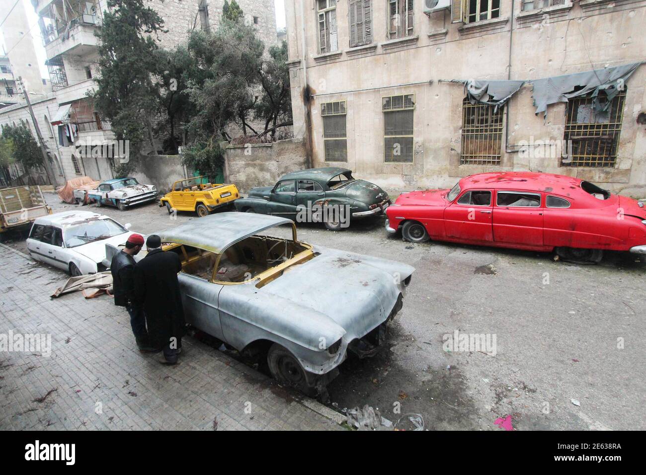 Mohamed Badr Al Din R Stands Next To His Vintage Cars Along A Street Where He Keeps Them In The Al Shaar Neighborhood Of Aleppo January 31 2015 The 66 Year Old Collector Nicknamed Abu Omar