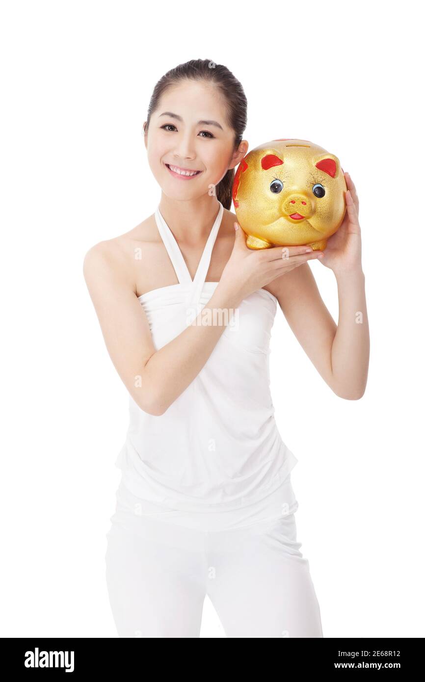 La jeune femme à la mode et la banque de porc photo de haute qualité Banque D'Images