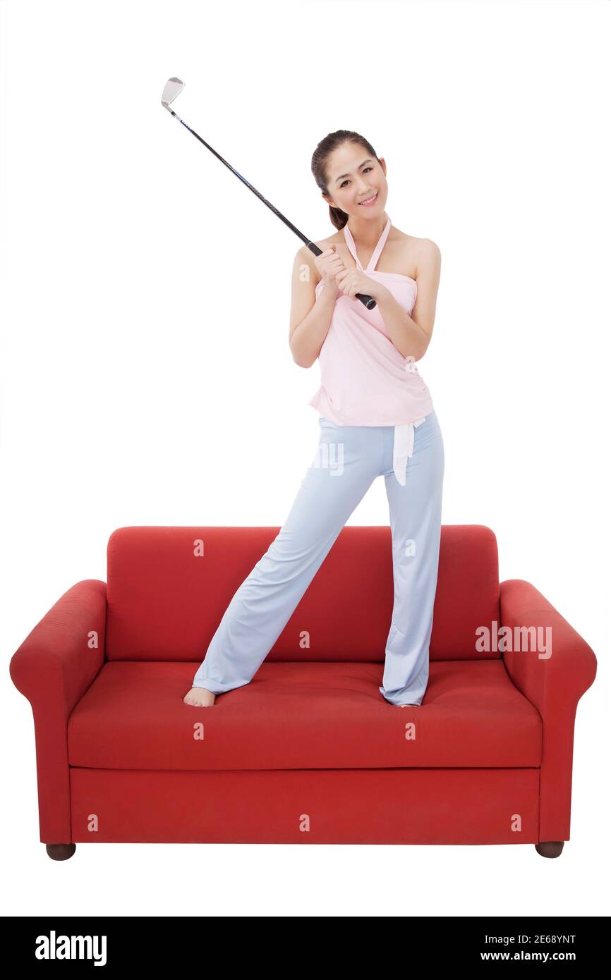 Femme de mode orientale avec un club de golf photo de haute qualité Banque D'Images