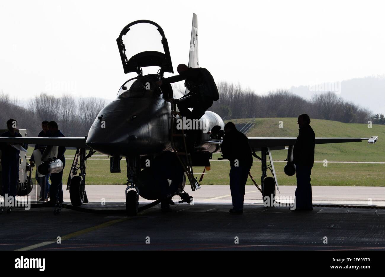 A Swiss Air Force F-5E Tiger aircraft returns in Payerne after a  radioactivity measurements flight over Switzerland March 23, 2011. An  aerosol collector is located under each wings of the aircraft and