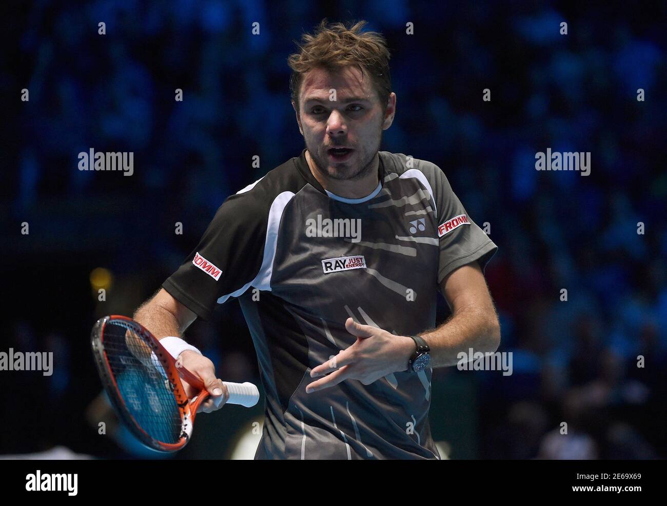 Stan Wawrinka of Switzerland gestures towards the coaches and family box of  Roger Federer of Switzerland, during their semi-final tennis match at the  ATP World Tour Finals at the O2 Arena in