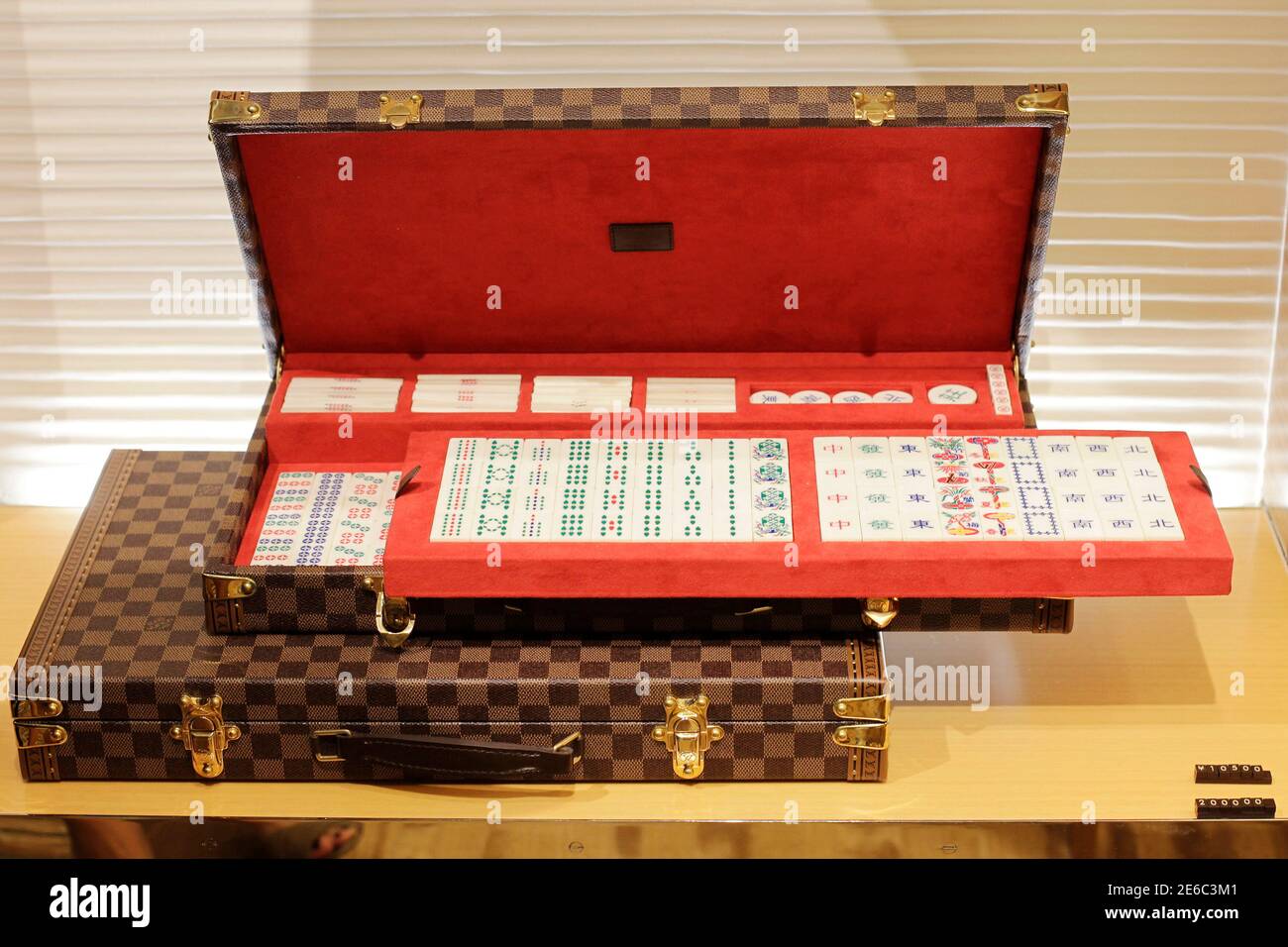 A Louis Vuitton package of mah-jong tiles is seen at the largest Louis  Vuitton store in China, which is located in Shanghai, July 18, 2012. Louis  Vuitton is courting China's wealthy with