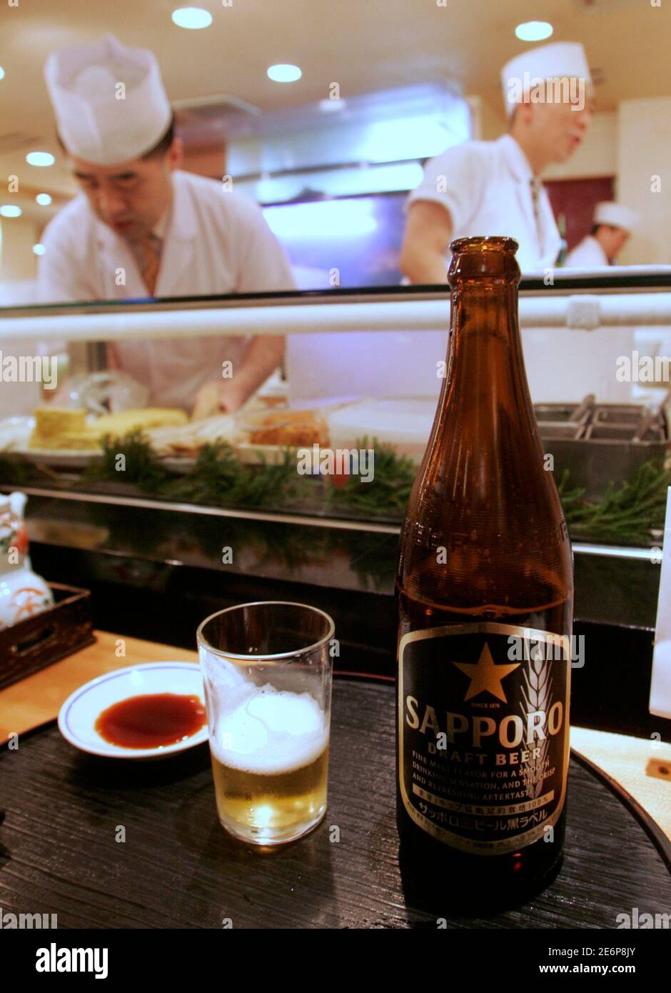 Sapporo Beer Is Served At A Restaurant In Tokyo February 19 07 Sapporo Holdings Shares Rose More Than 2 Percent On Monday To Their Highest Level In 9 Years As Investors Bet