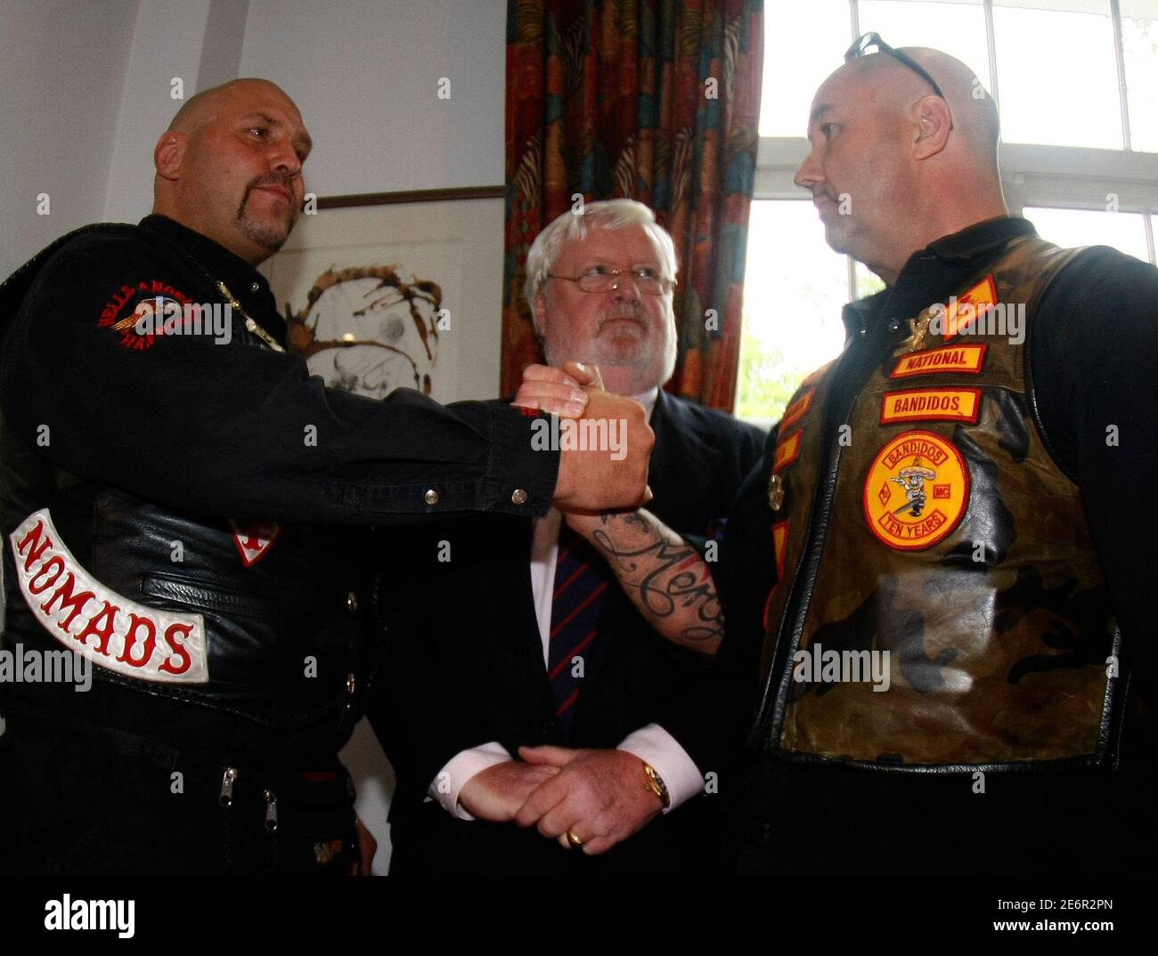 Lawyer Goetz Von Fromberg C Watches As Peter Maczollek President Of The Mc Bandidos Motorcycle Gang In Germany And Frank Hanebuth L President Of The Hells Angels Charters Of Hannover Shake Hands
